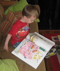 Photo of child engaged with book